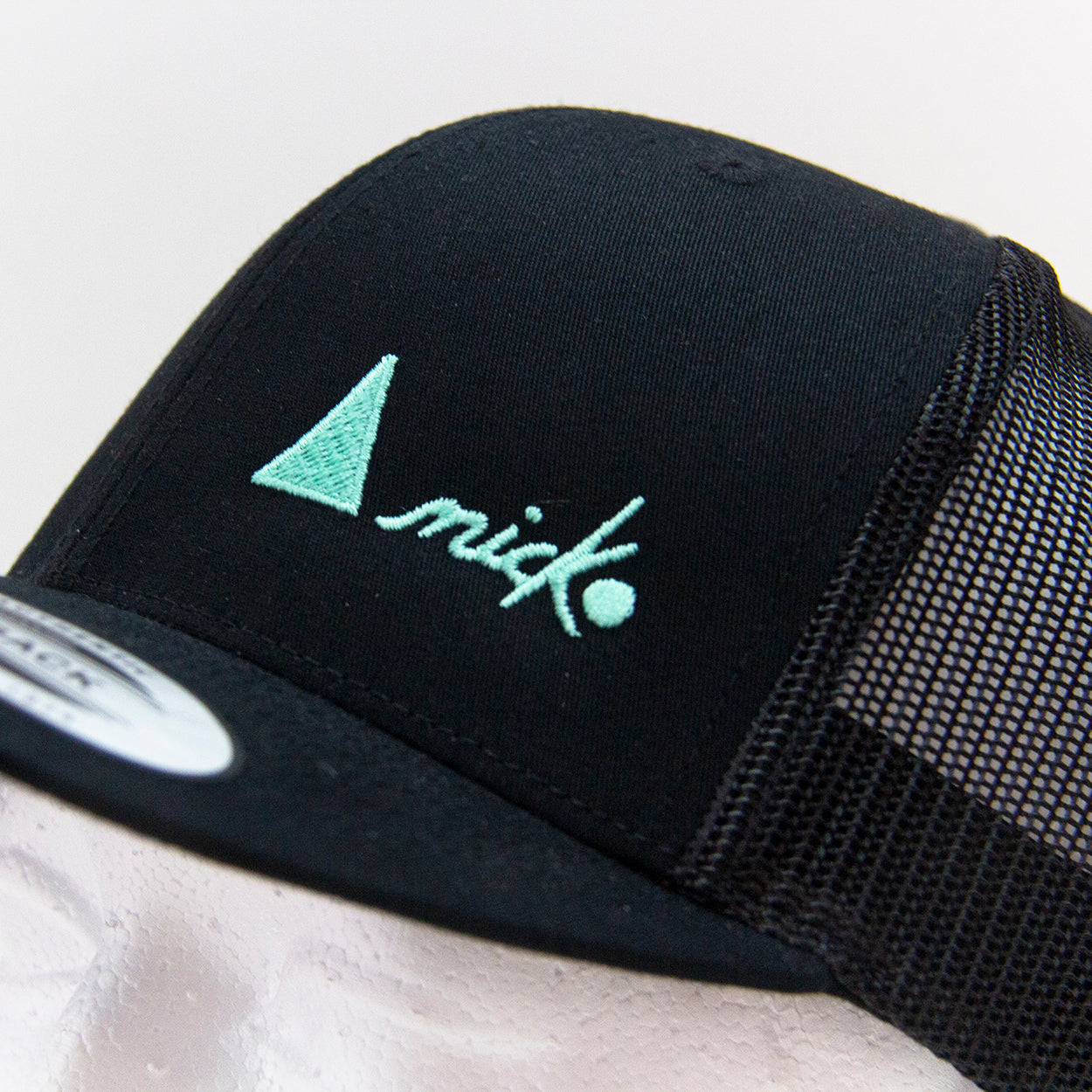 THE TRUCKER CAP WITH TURQUOISE LOGO - SNAPBACK