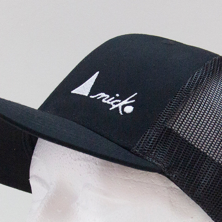 THE TRUCKER CAP WITH WHITE LOGO - SNAPBACK